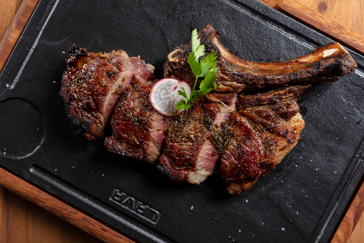 tomahawk meat sliced at bocados grill restaurant