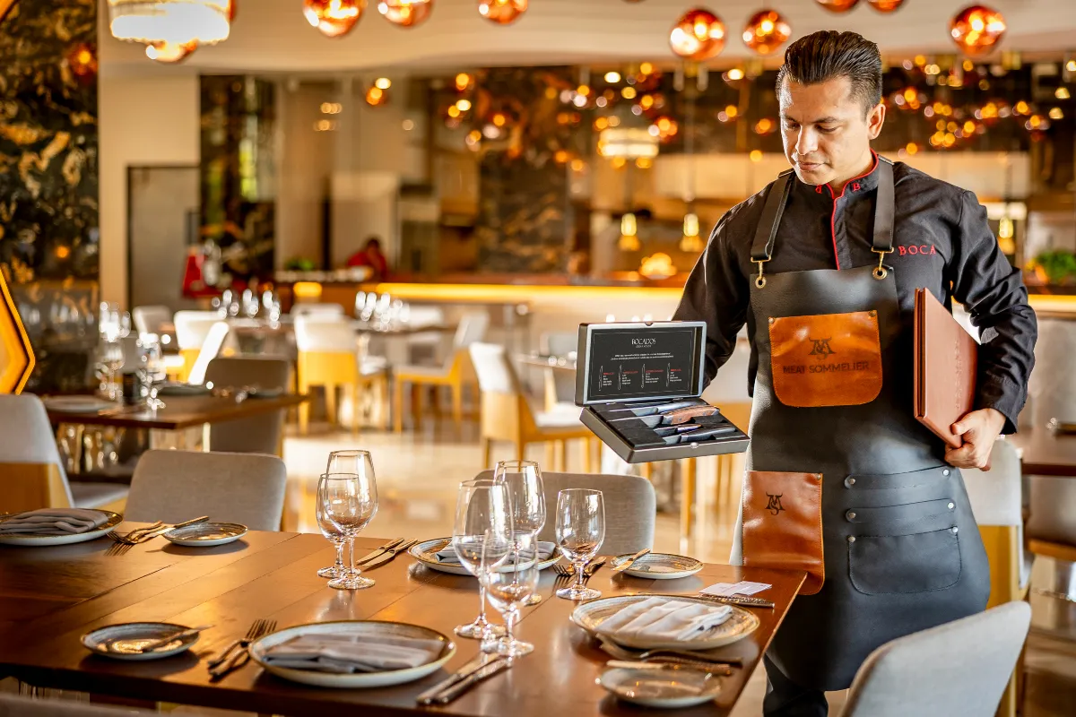 Garza Blanca Cabo meat sommelier presenting fine cuts of meat