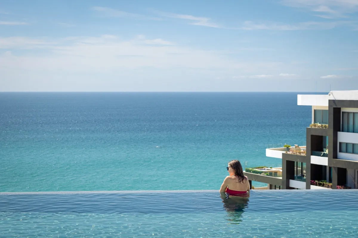 Girl enjoying the exclusive Garza Blanca Los Cabos rooftop view