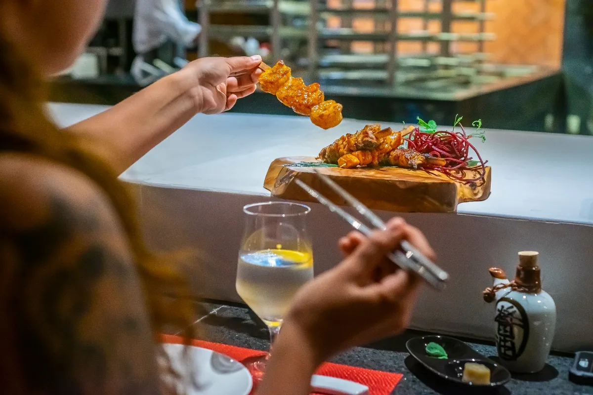 Guests enjoying the Robata experience at Garza Blanca Cabo Hiroshi restaurant